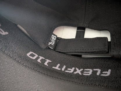 The Sòlas Cap. Close up of moisture wicking sweatband, adjustable D-Loop and the An Turas™ flag label.